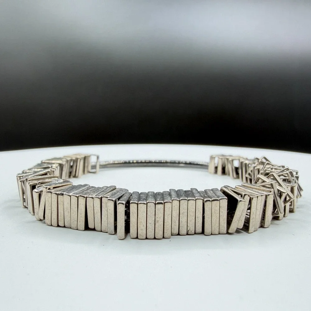 N/A sculptural silver